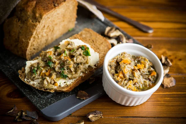 Home cooked natural mushroom caviar from forest dried mushrooms on a wooden table — Stock Image Home Cooked Natural Mushroom Caviar Forest Dried Mushrooms Wooden Table Royalty Free Stock Images