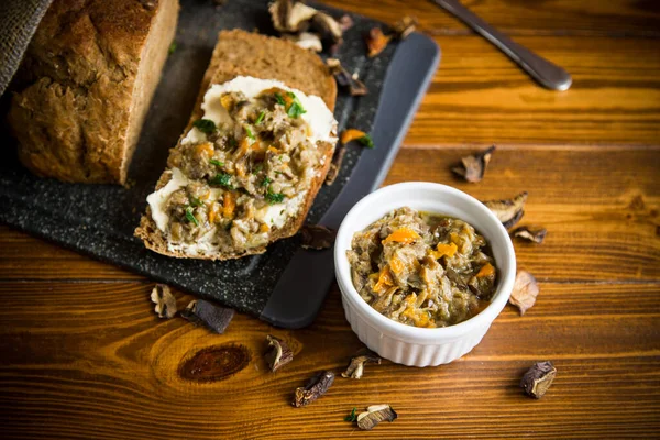 Home cooked natural mushroom caviar from forest dried mushrooms on a wooden table — Stock Image Home Cooked Natural Mushroom Caviar Forest Dried Mushrooms Wooden Table Royalty Free Stock Photos