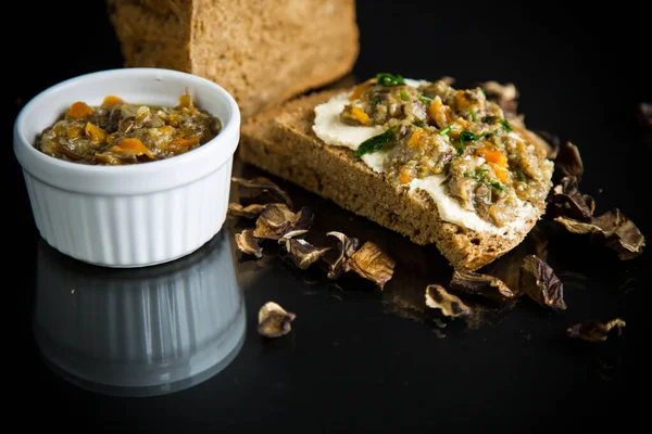 Home cooked natural mushroom caviar from forest dried mushrooms isolated on black background — Stock Image Home Cooked Natural Mushroom Caviar Forest Dried Mushrooms Isolated Black Royalty Free Stock Images