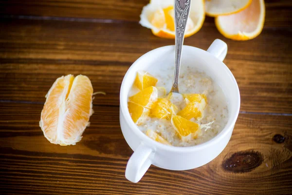 Cooked Boiled Sweet Oatmeal Oranges Bowl Wooden Table — Stock Photo, Image