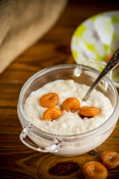 Cooked Boiled Sweet Oatmeal Dried Apricots Bowl Wooden Table — Stock Photo, Image