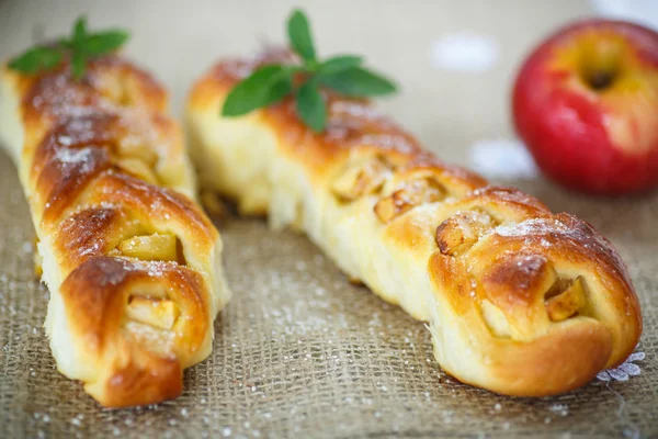 Baked braided pigtails with apples — Stock Photo, Image