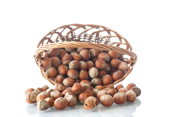Hazelnuts in a wicker basket — Stock Photo, Image