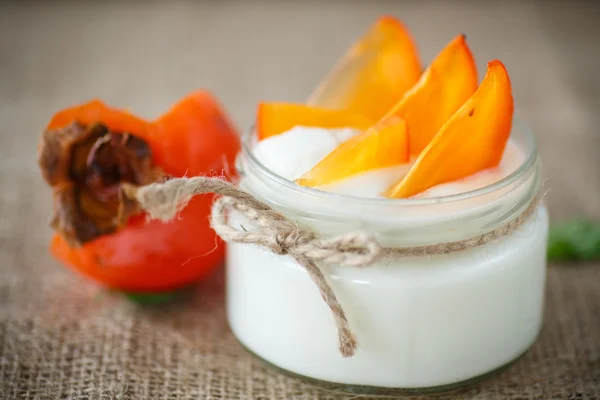 Sweet homemade yogurt with persimmons — Stock Photo, Image