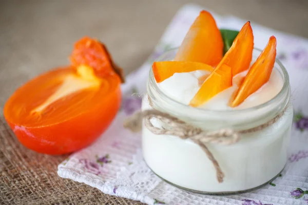 Sweet homemade yogurt with persimmons — Stock Photo, Image