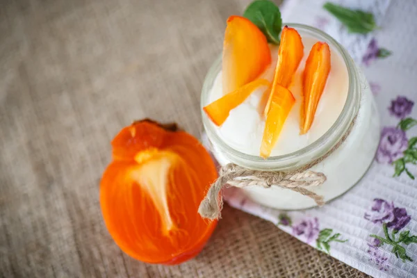 Sweet homemade yogurt with persimmons — Stock Photo, Image
