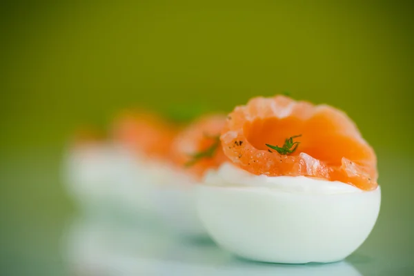 Boiled eggs with salt red fish — Stock Photo, Image