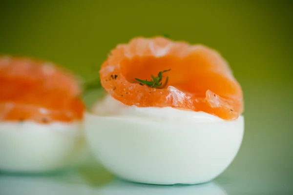 Boiled eggs with salt red fish — Stock Photo, Image