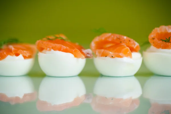 Boiled eggs with salt red fish — Stock Photo, Image