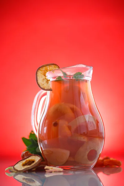 Compote of dried fruits in a carafe — Stock Photo, Image