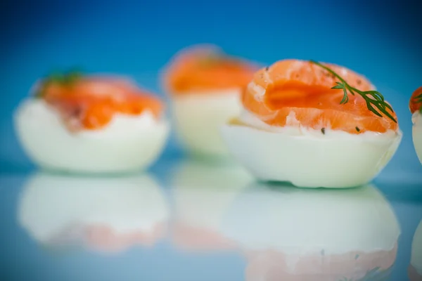 Boiled eggs with salt red fish — Stock Photo, Image