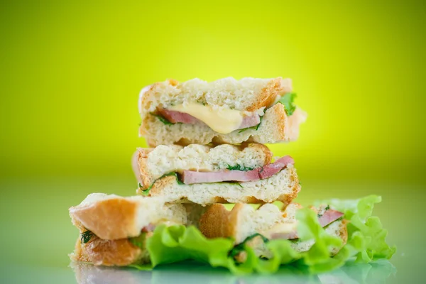 Hot sandwiches with ham and cheese — Stock Photo, Image
