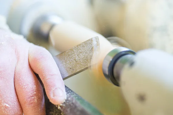 Hand with a chisel in the course of the woodwork — Stock Photo, Image