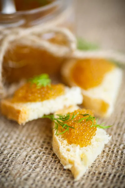 Bread spread with salted pike caviar — Stock Photo, Image