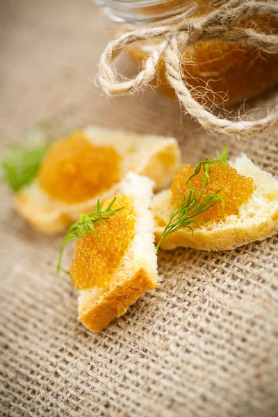 Bread spread with salted pike caviar — Stock Image Bread spread with salted pike caviar Stock Photo
