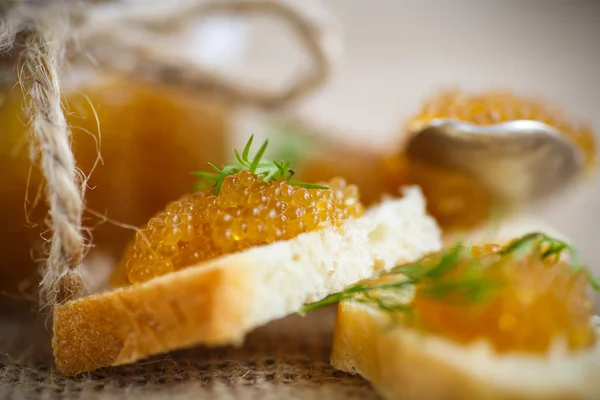 Bread spread with salted pike caviar — Stock Image Bread spread with salted pike caviar Stock Image