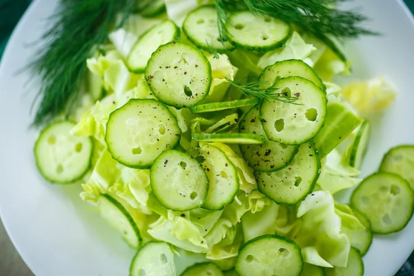 Spring salad with cabbage and cucumbers — Stock Photo, Image