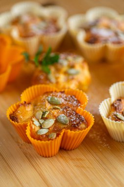 Rustic homemade muffins made from cottage cheese and seeds.
