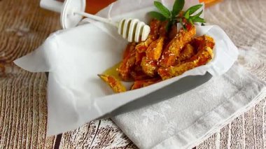 Homemade roasted pumpkin wedges with golden crust and honey.