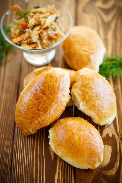 Homemade pies with cabbage and sauerkraut — Stock Photo, Image