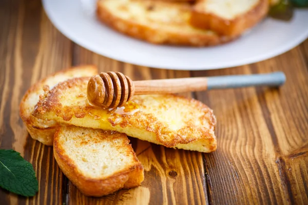 Fried in batter toast with honey — Stock Photo, Image