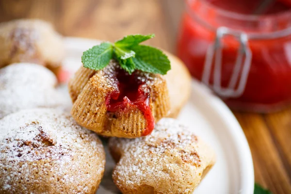 Sweet muffins with fruit jam inside — Stock Photo, Image
