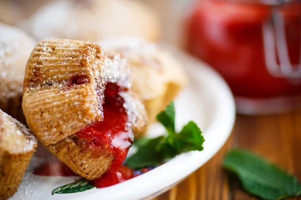 Sweet muffins with fruit jam inside — Stock Photo, Image