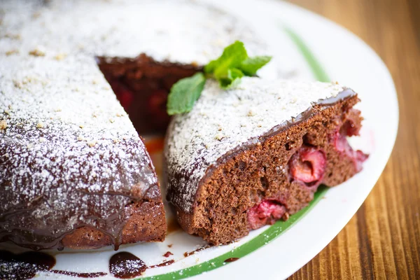 Chocolate cake stuffed with cherries — Stock Photo, Image