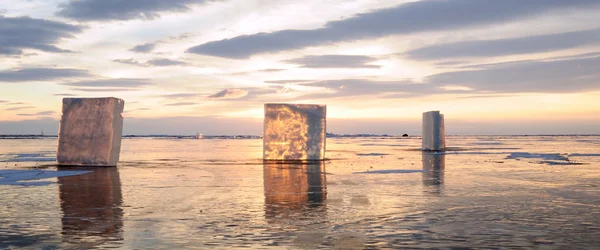 transparent pieces of ice on the surface of the iced pond. Baikal lake. Photo toned