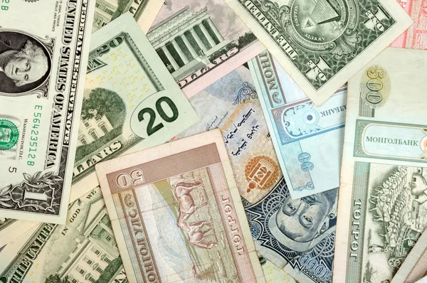 Tło składające się z losowo mieszane banknoty z różnych krajów — Zdjęcie stockowe