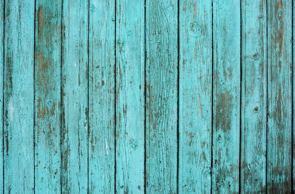 Background consisting of old wooden boards with traces of peeling paint. partially tinted photo. — Stock Photo, Image