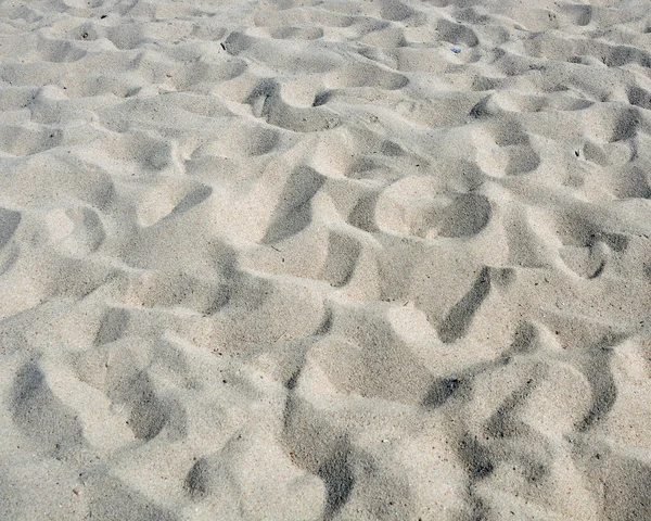 Areia, fundo natural em branco — Fotografia de Stock