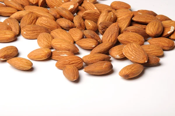 Almond nuts on white — Stock Photo, Image