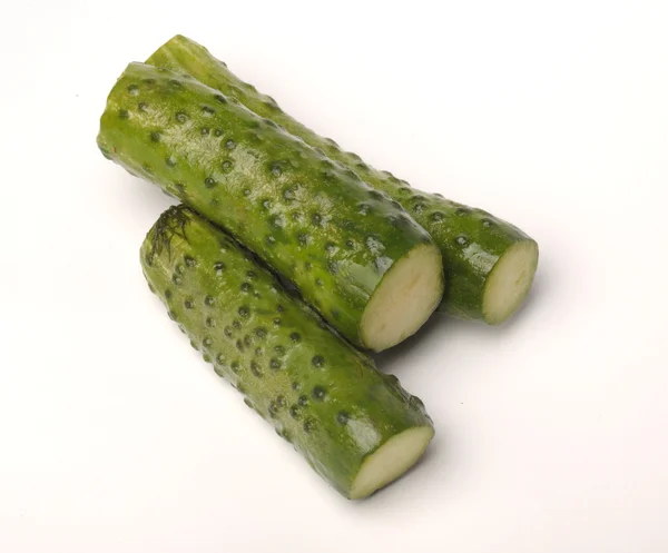 Salted cucumber on white, traditional snack while drinking vodka — Stock Photo, Image