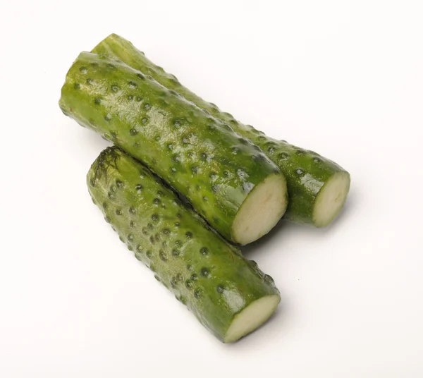 Salted cucumber on white, traditional snack while drinking vodka — Stock Photo, Image