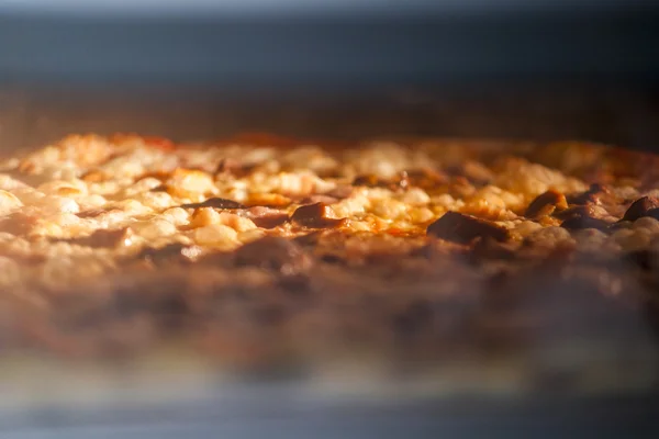 Pizza baking in the oven