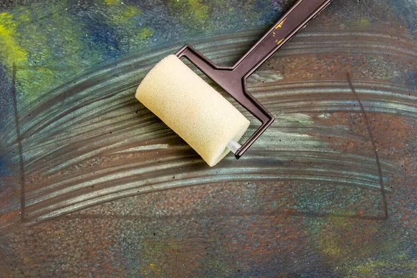 Paint Roller Dark Paint Background Stock Photo