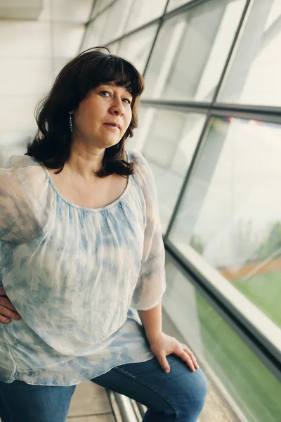 Woman near the window in airport — Stock Photo, Image