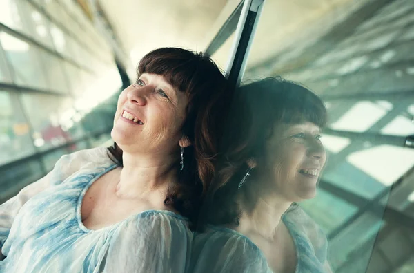 Woman near the window in airport — Stock Photo, Image