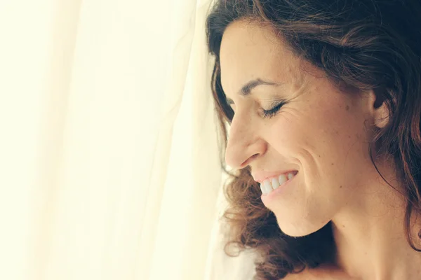 Woman near window — Stock Photo, Image