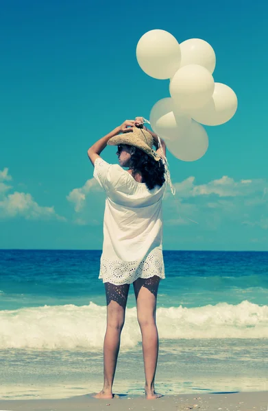 Woman with white balloons — Stock Photo, Image