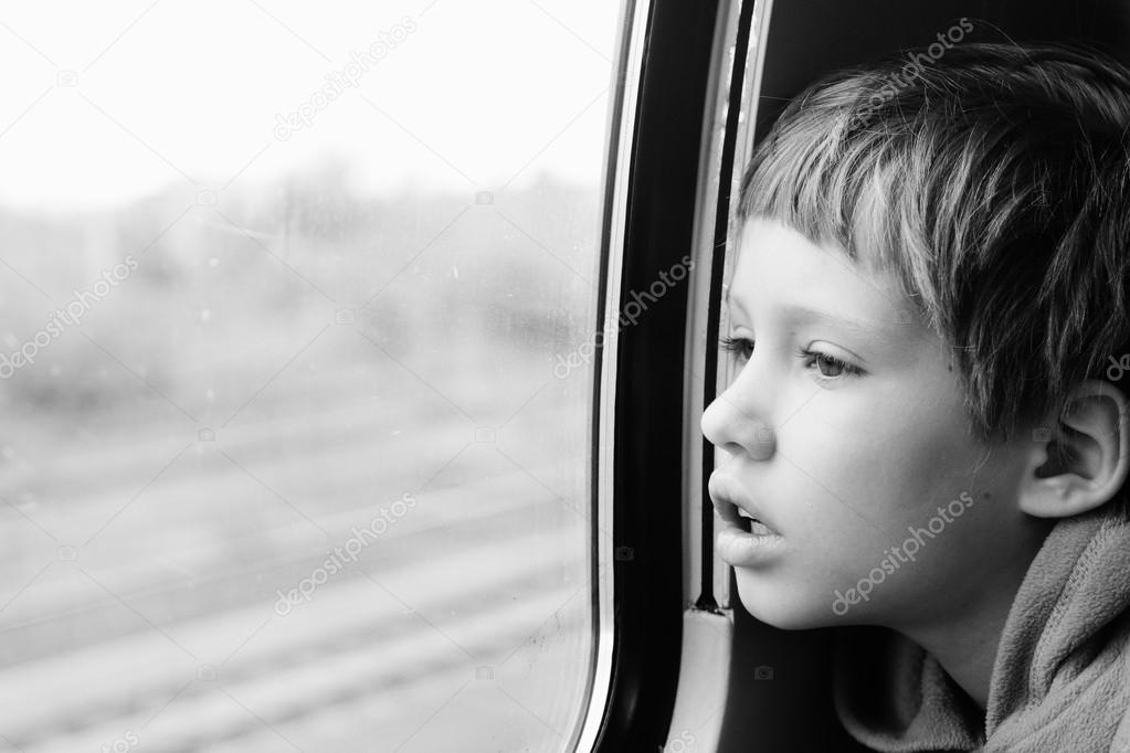 Boy looking through the window