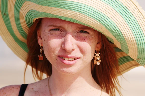 Beautiful young redhead girl in hat — Stock Photo, Image