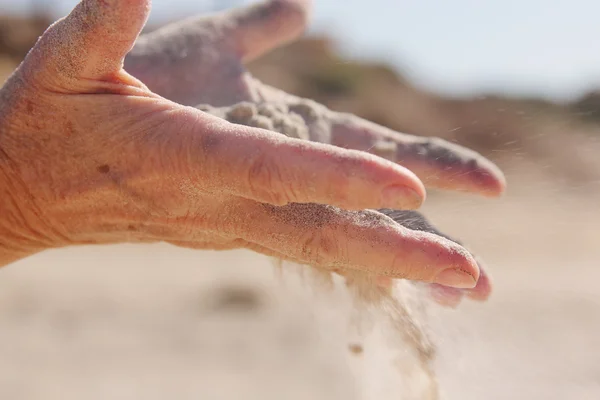 Sand in hands — Stock Photo, Image