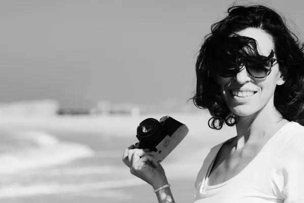 Woman with vintage retro camera — Stock Photo, Image