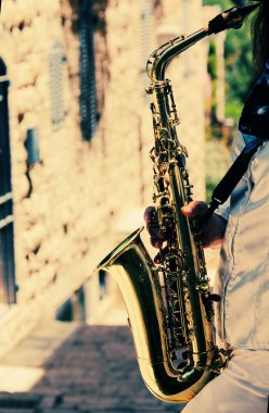 Saxophonist playing on saxophone clipart