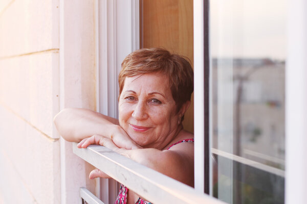 woman posing on balcony