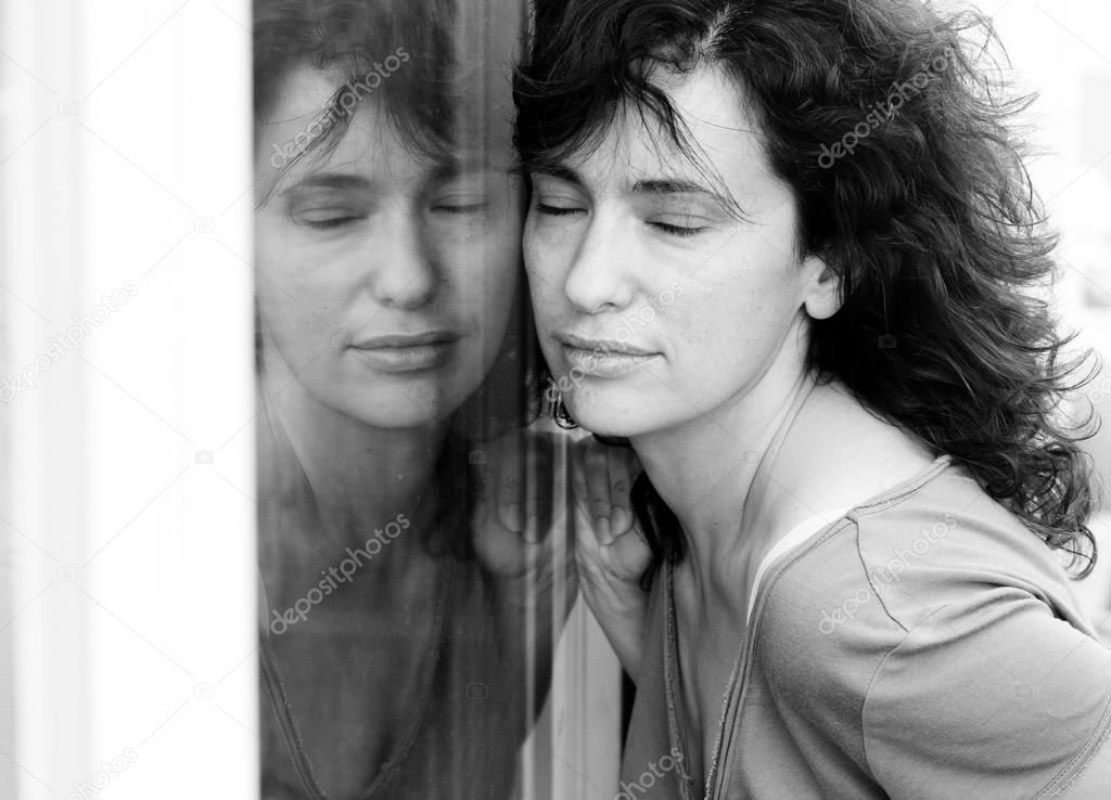 woman posing near window