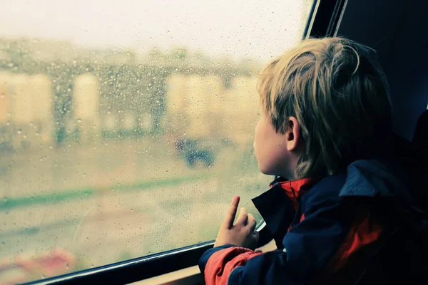 Little boy sitting in train — Stock Photo, Image