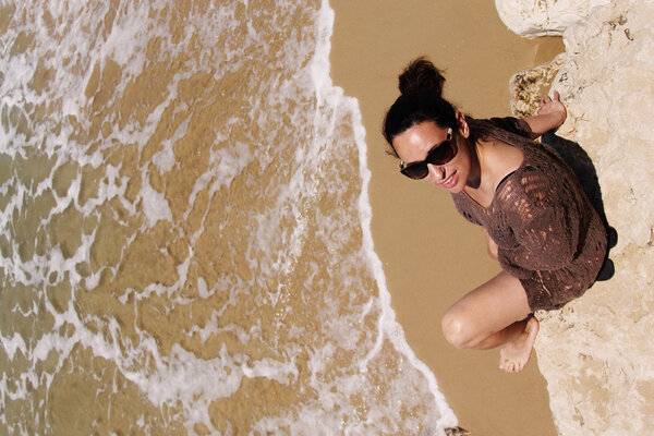 Woman sitting on the beach